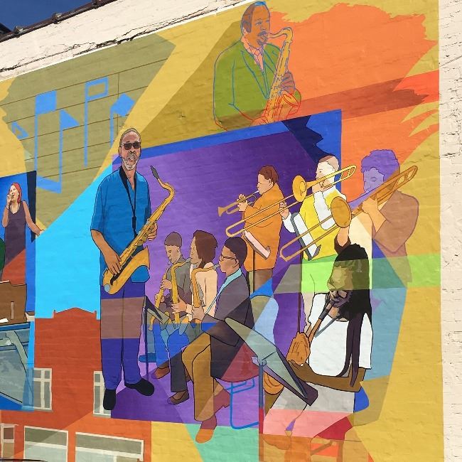 Detail of mural by Jared Bader, featuring influential Kinston music educators. Detail of mural by Jared Bader, featuring influential Kinston music educators.