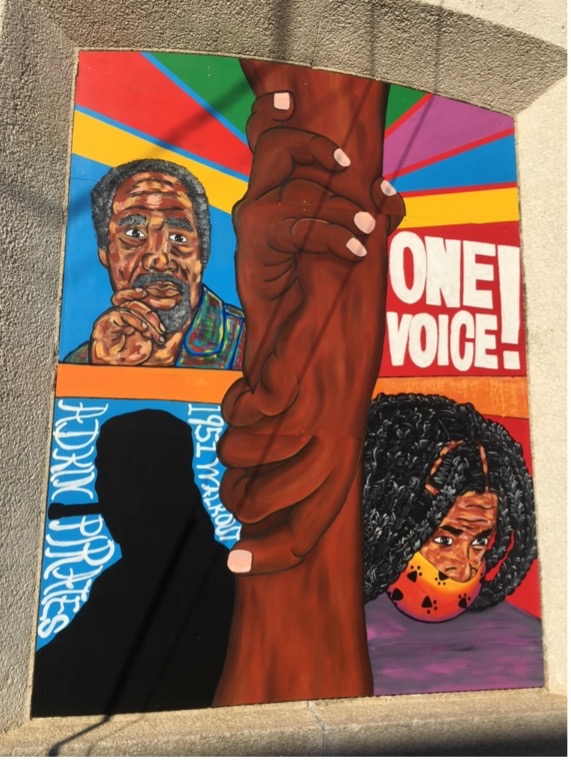 "One Voice" panel from the "Adkin High School Walkout" mural series. Panel created by Maximillian Mozingo.